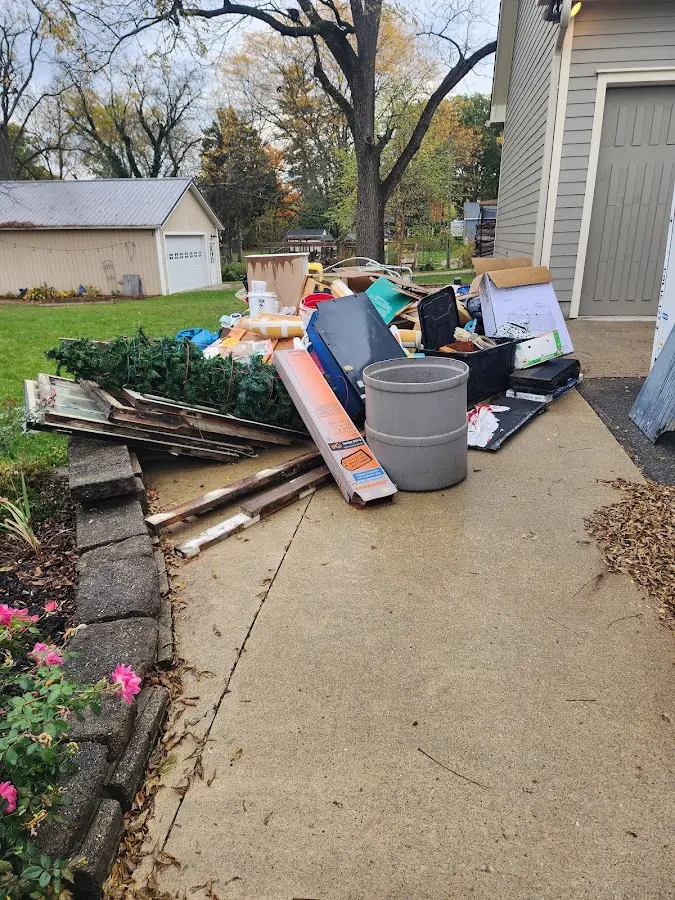Dumpster being loaded with debris for 3 Yard Dumpster Rental in Nassau Bay